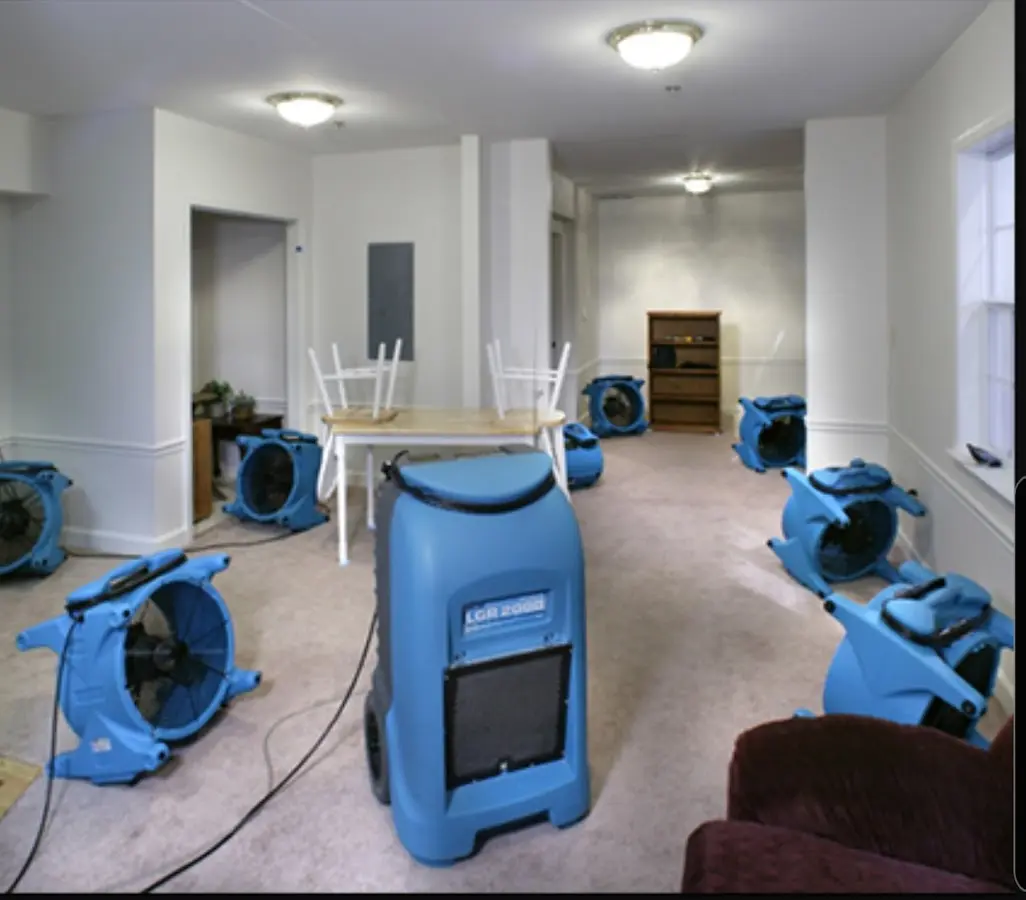 Air movers and dehumidifier setup for Water Damage Restoration in Radford